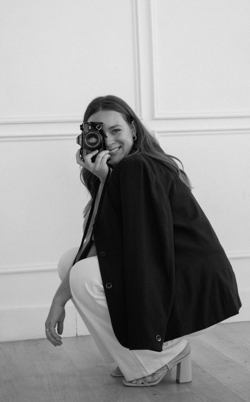 Portrait photographer holding a camera